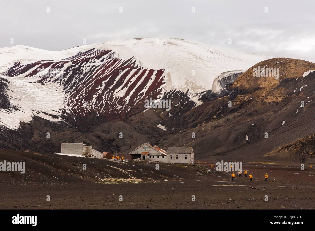 snowy mountains and dilapidated buildings of the abandoned whaling and scientific station of deception island antarctica Stock Photo