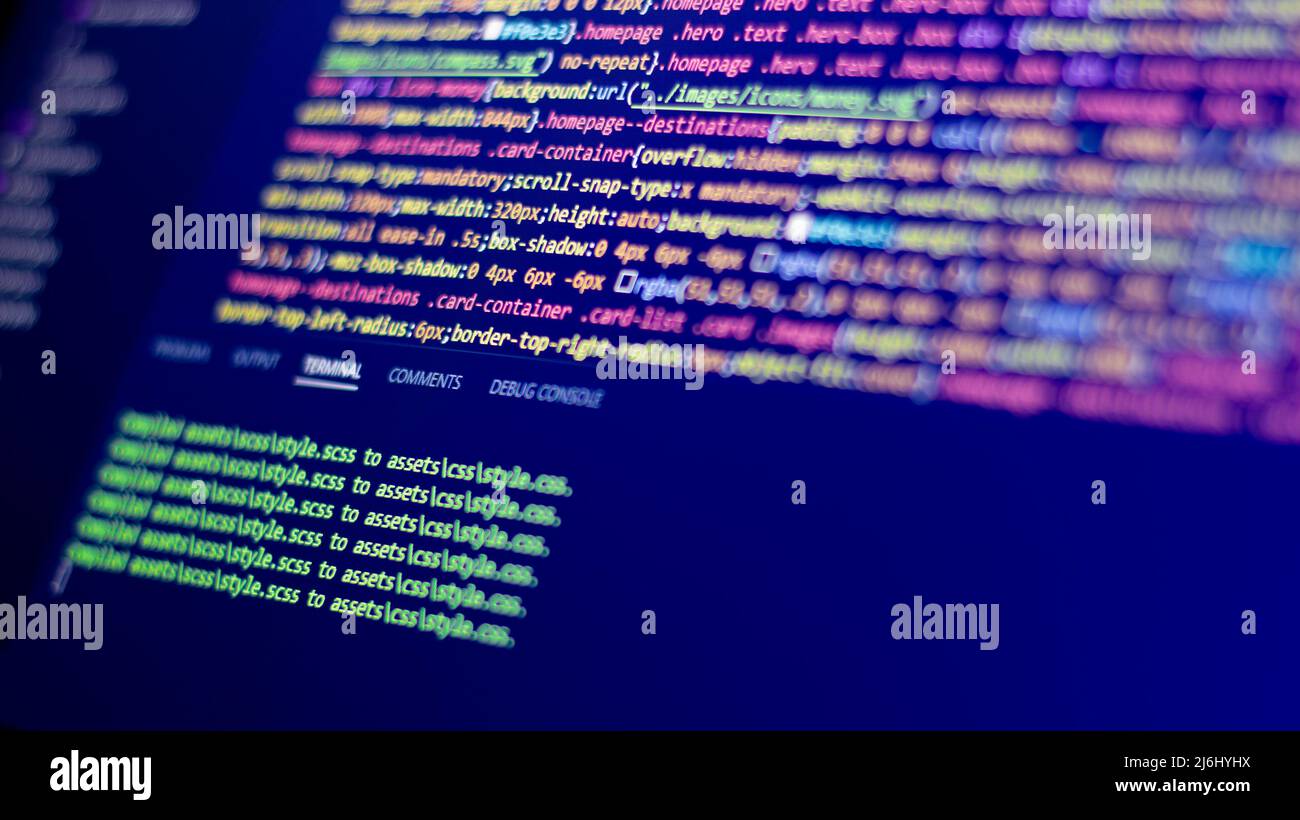 many colors half blurred codes line on screen. green commands one under the other. selective focus creative software idea photo concept. Stock Photo