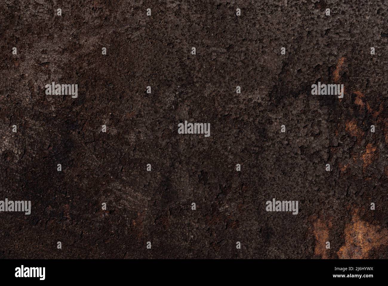 Dark brown bumpy rough surface, iron background with rust. High quality photo Stock Photo