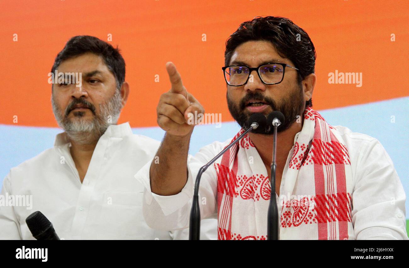 Gujrat independent MLA (Member of Legislative Assembly) Jignesh Mevani (R) along with congress party member Rajesh Lilothia (L) address to the media during a press conference at the Indian National Congress party headquarter in New Delhi. After he was released on bail over two cased filed on April 20, 2022 and April 25, 2022 in Assam State. He told the media it was pre planned conspiracy to destroy him and also slammed the central Prime Minister Narendra Modi's government. Stock Photo