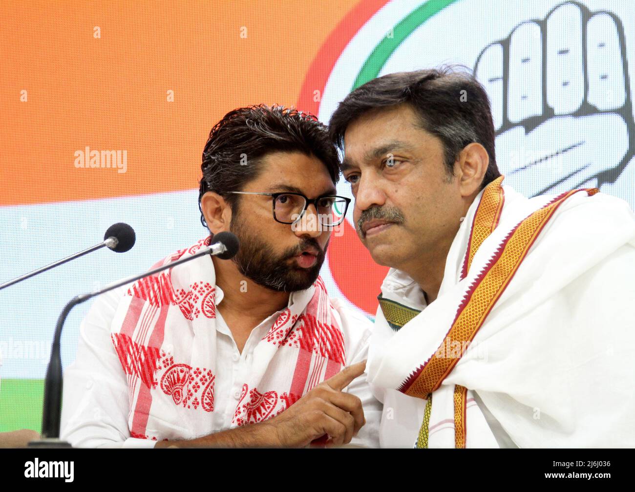 Gujrat independent MLA (Member of Legislative Assembly) Jignesh Mevani (L) along with congress party member Rajesh Lilothia (R) address to the media during a press conference at the Indian National Congress party headquarter in New Delhi. After he was released on bail over two cased filed on April 20, 2022 and April 25, 2022 in Assam State. He told the media it was pre planned conspiracy to destroy him and also slammed the central Prime Minister Narendra Modi's government. (Photo by Naveen Sharma / SOPA Images/Sipa USA) Stock Photo