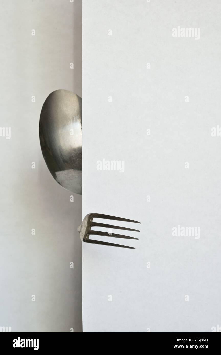 Abstract person from spoon and forks on white background Stock Photo