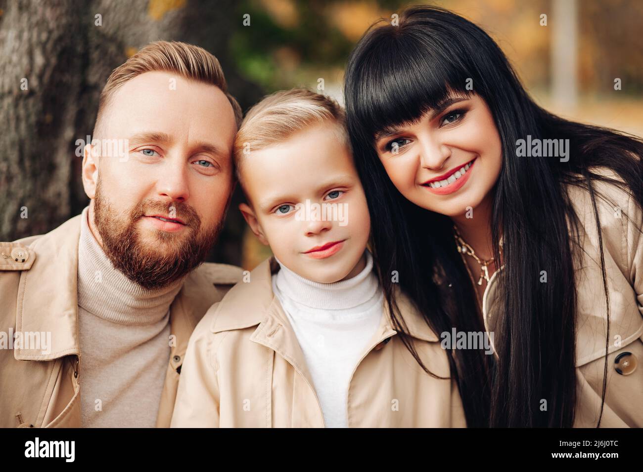 Happy family, portrait. Dad, Mom, Son smile, look at the camera Stock ...