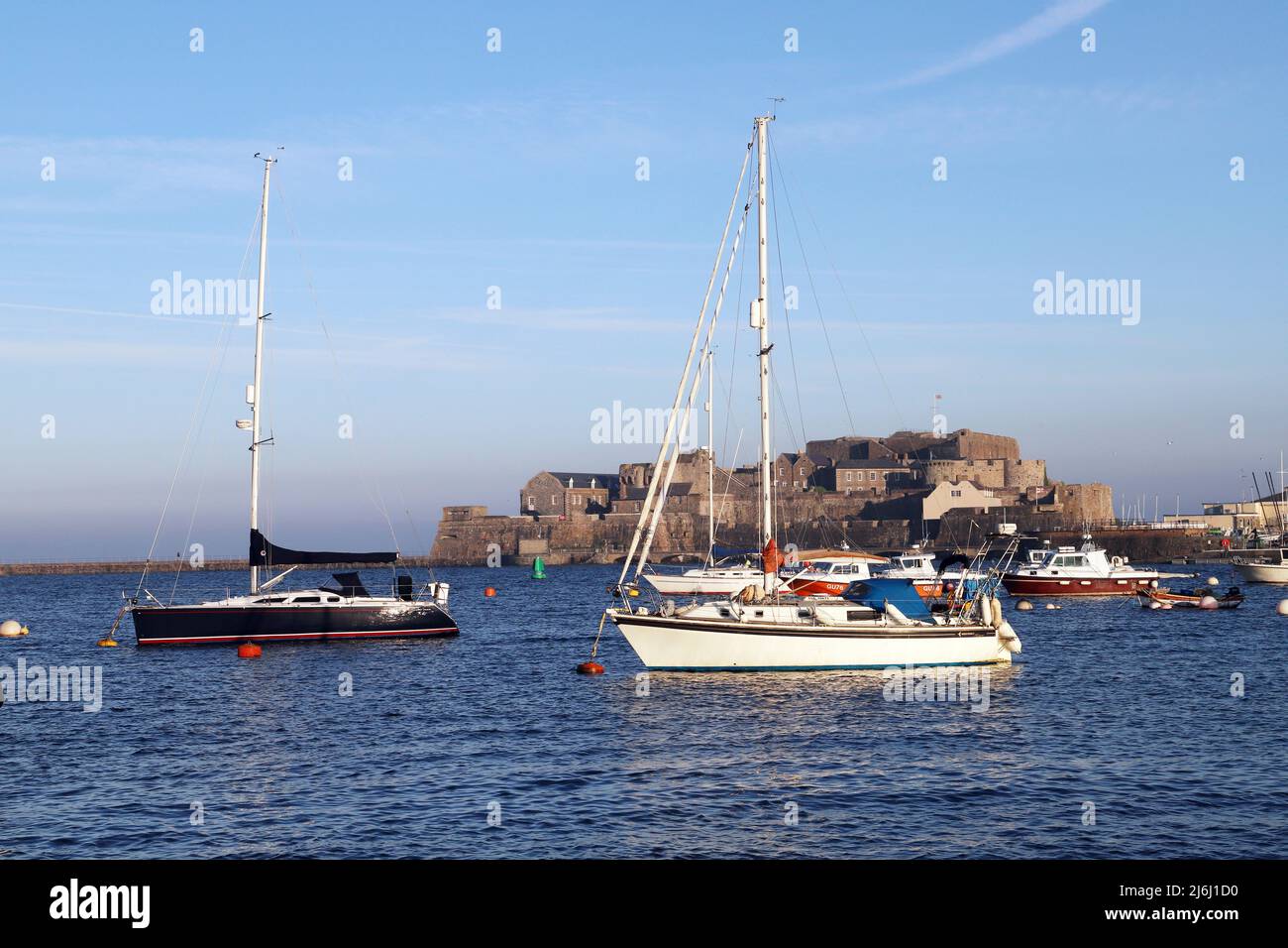 Yachts moored in St Peter Port Harbour, Guernsey, Channel Islands Stock Photo