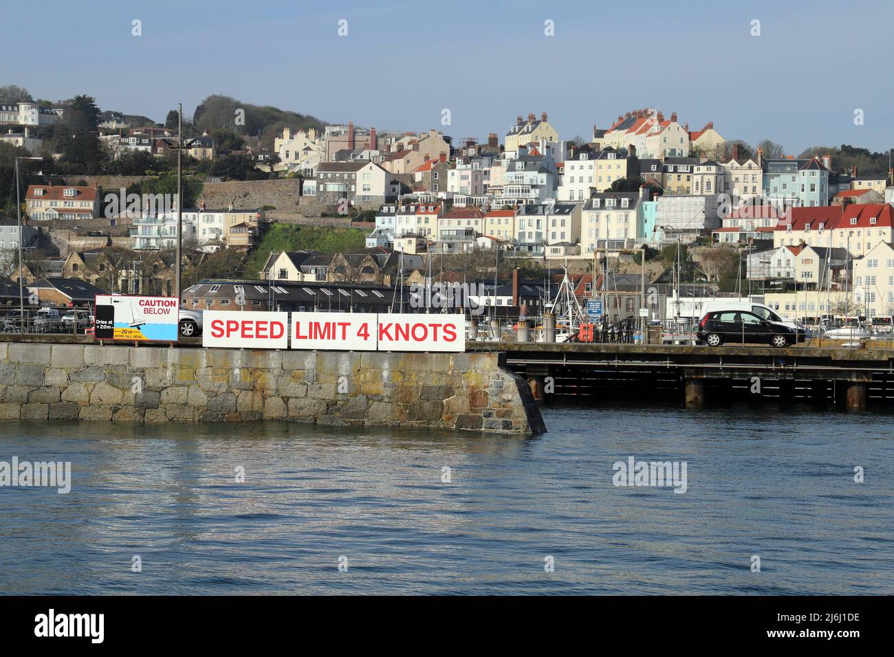 Speed limit 4 knots. Sign in St Peter Port Harbour, Guernsey, Channel Islands Stock Photo