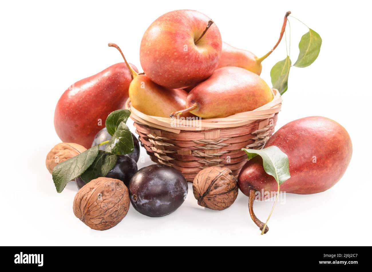 pears, plums and walnuts on a white background with soft shadow Stock Photo