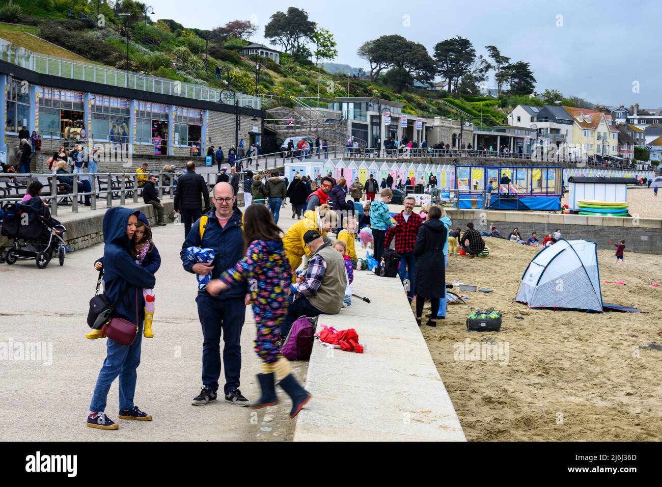 Lyme Regis, Dorset, UK. 2nd May 2022. UK Weather: Visitors and locals enjoy the bank holiday despite the over cast weather.  Credit: Celia McMahon/Alamy Live News Stock Photo