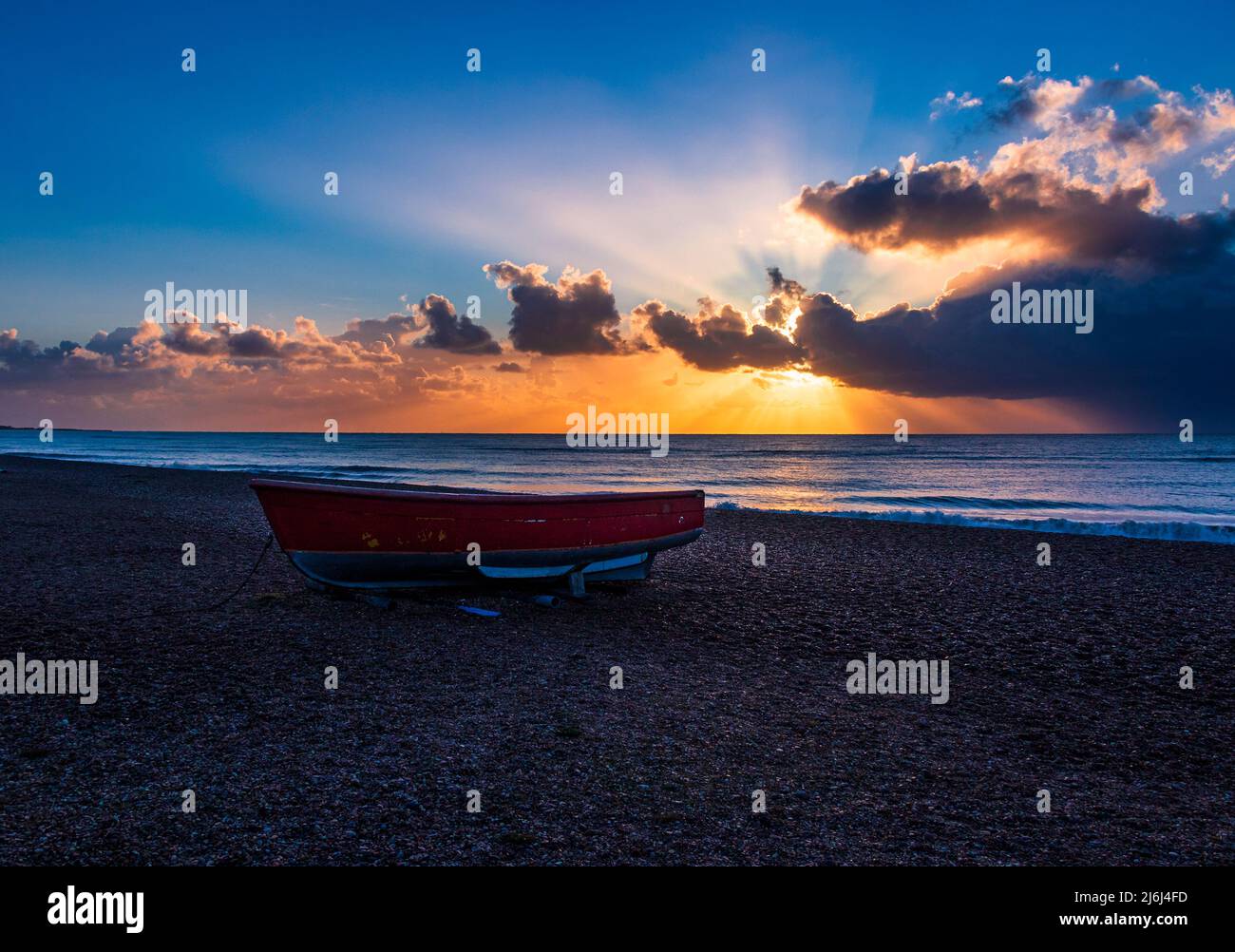 May golden light on Dunwich beach Suffolk early in the morning east