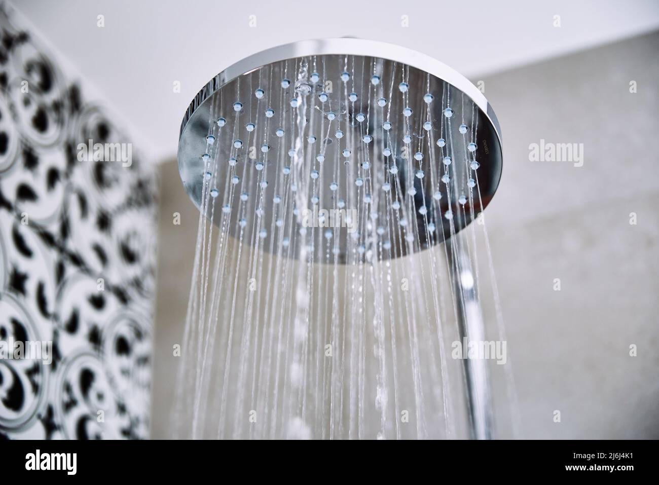 https://c8.alamy.com/comp/2J6J4K1/water-flowing-from-shower-head-in-bathroom-2J6J4K1.jpg