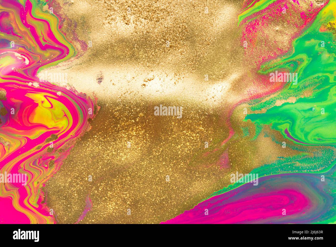 Gold dust spots on liquid fluorescent paints background Stock Photo Alamy