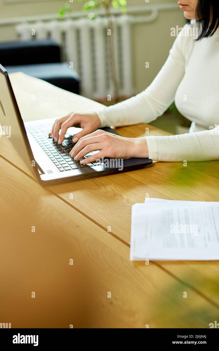 Close up female hands searching on laptop, woman working online ...
