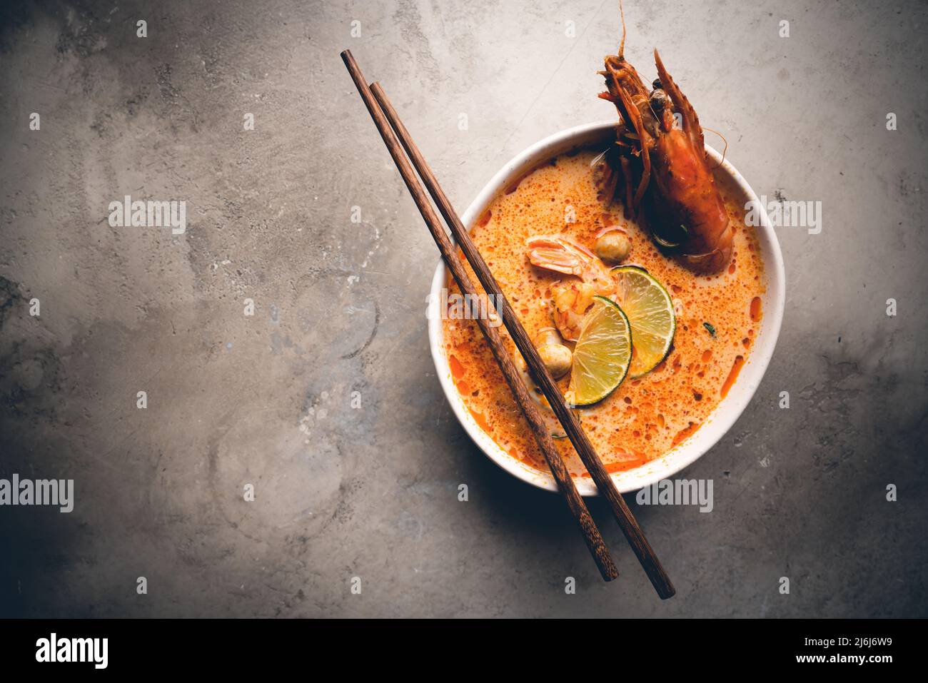 Tom Yam kung Spicy Thai soup with shrimp, seafood, coconut milk and