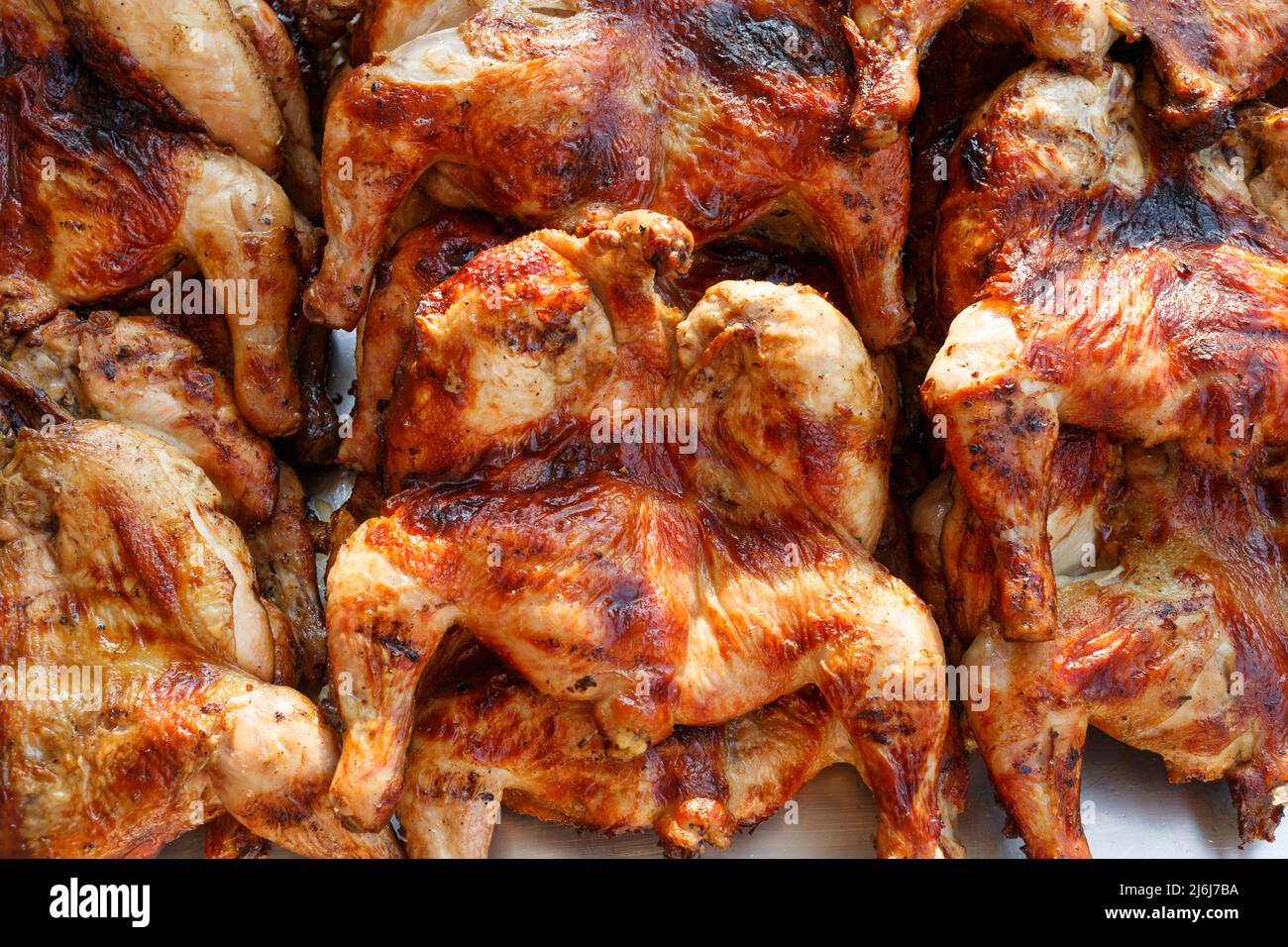 Local street food, delicious charcoal grill whole chicken barbecue in asian thai style. Stock Photo