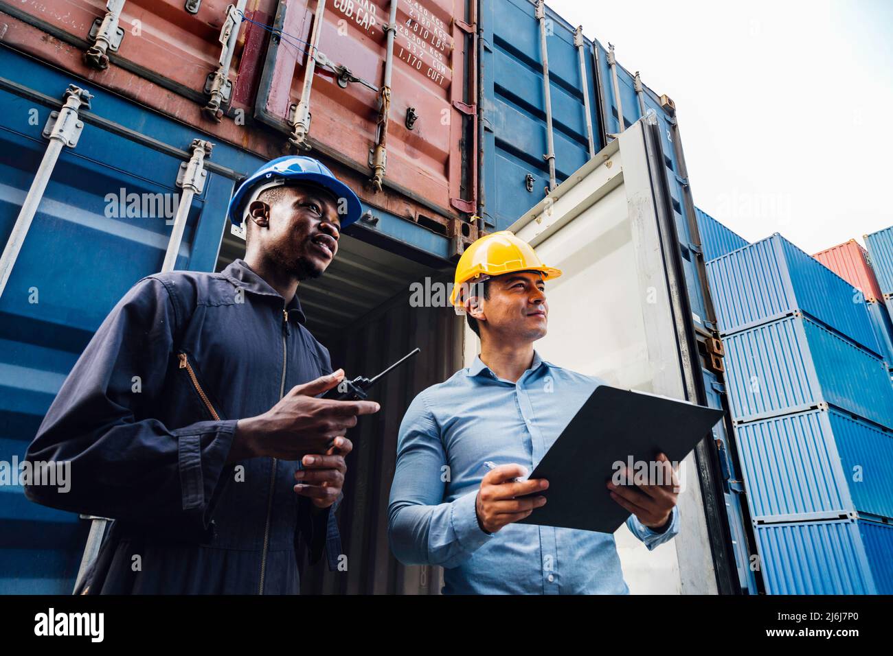 professional engineer and businessman checking and inspect containers in international cargo at the logistic port.  industrial, transportation, wareho Stock Photo