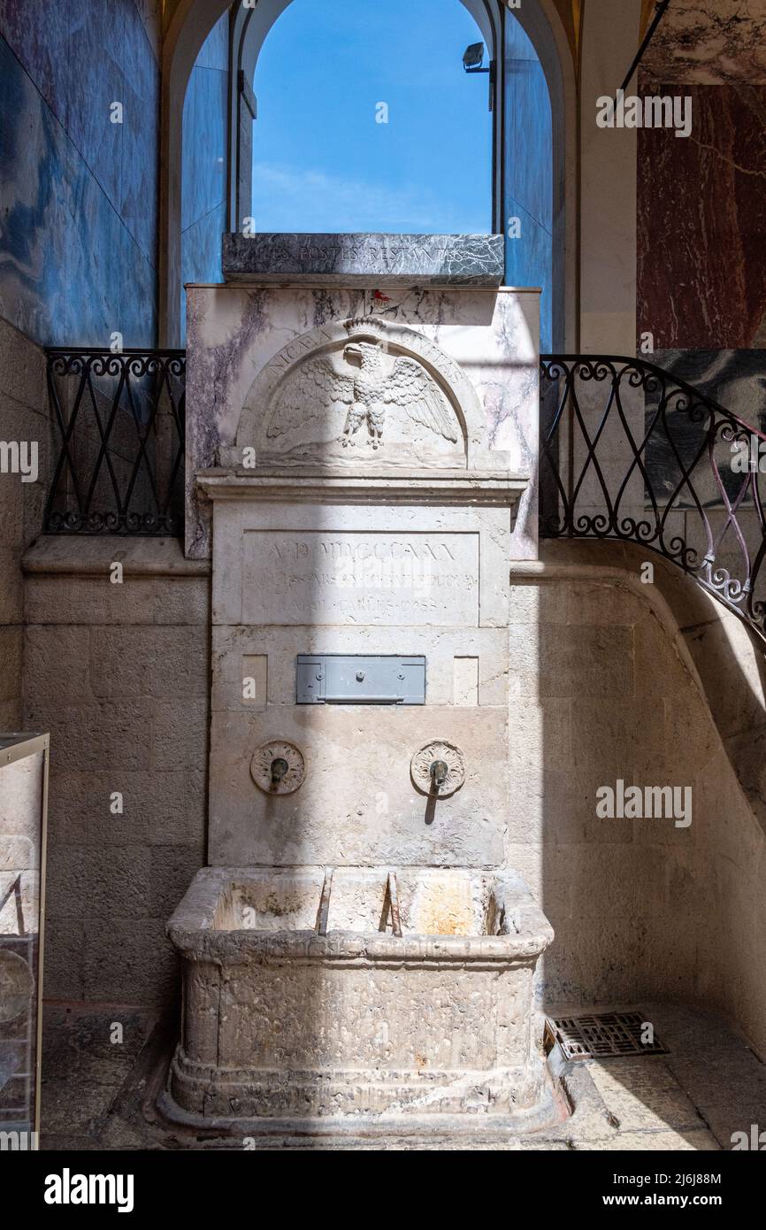 The water fountain at Porte Fausse in Old Nice, One of the entrances to the Old Town. Stock Photo