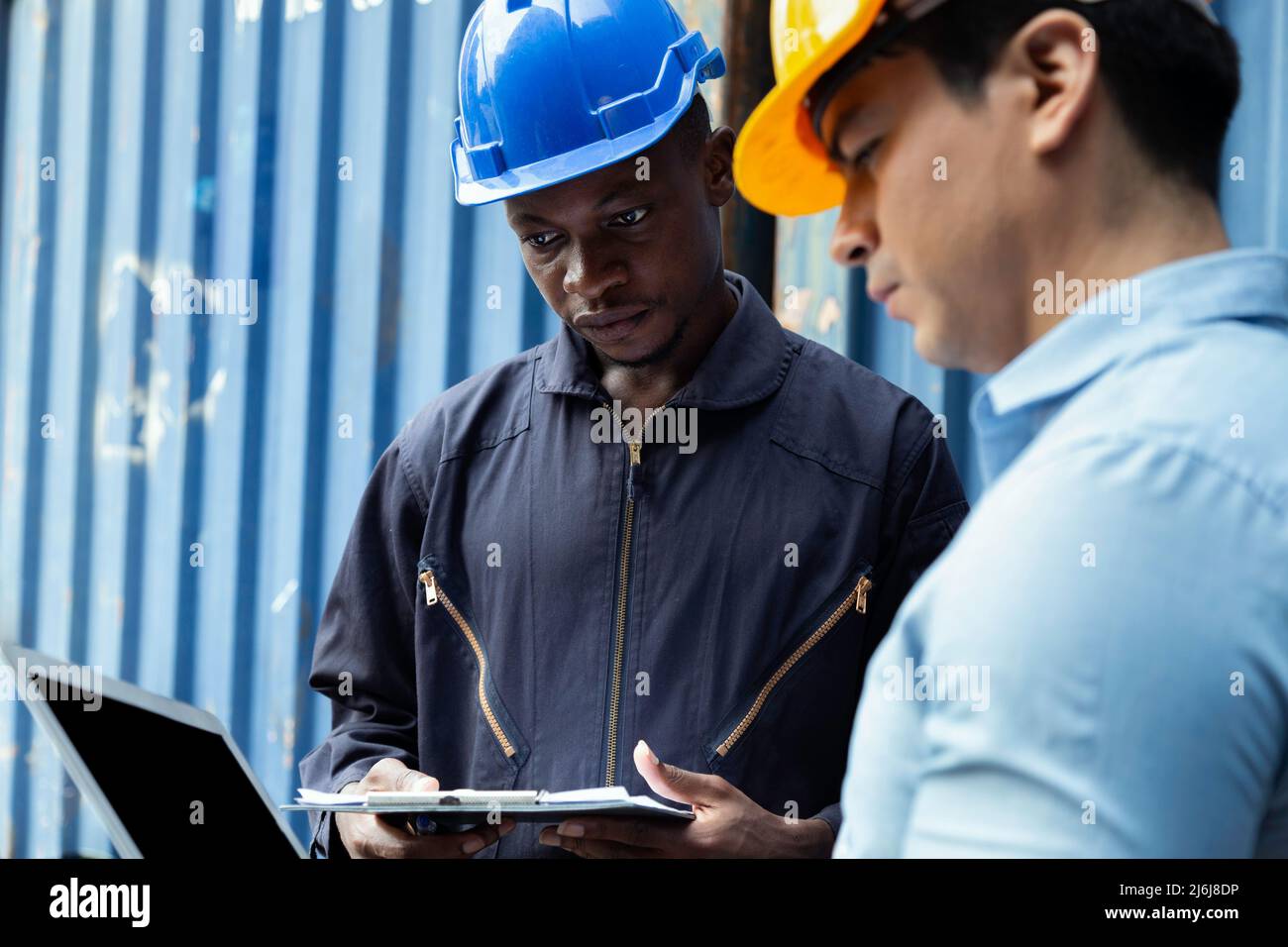 professional engineer and businessman checking and inspect containers in international cargo at the logistic port. industrial, transportation, warehou Stock Photo