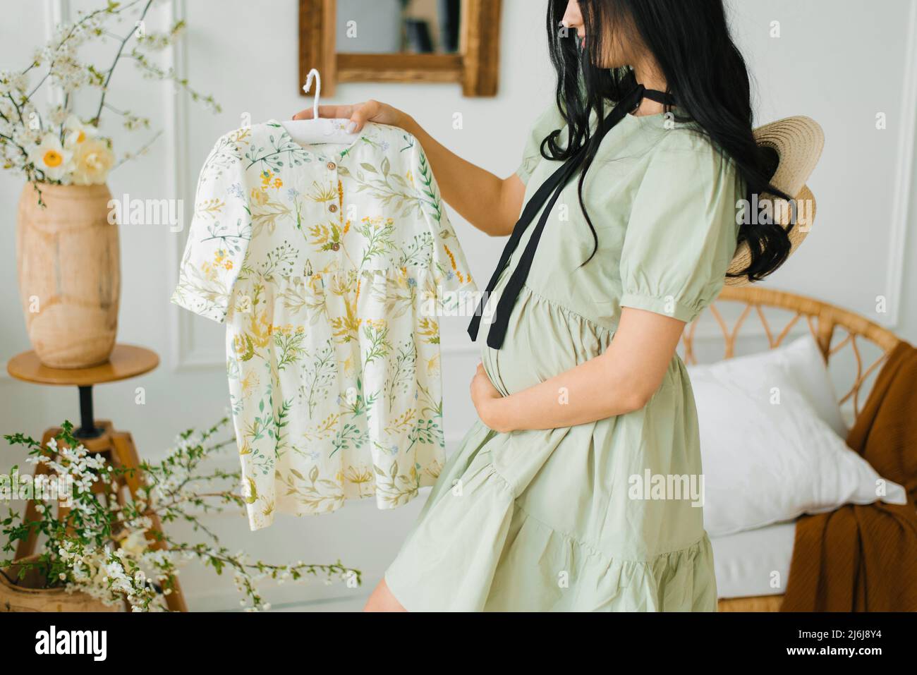 Hands showing a pregnancy belly cast decorated with lace and flower Stock  Photo - Alamy