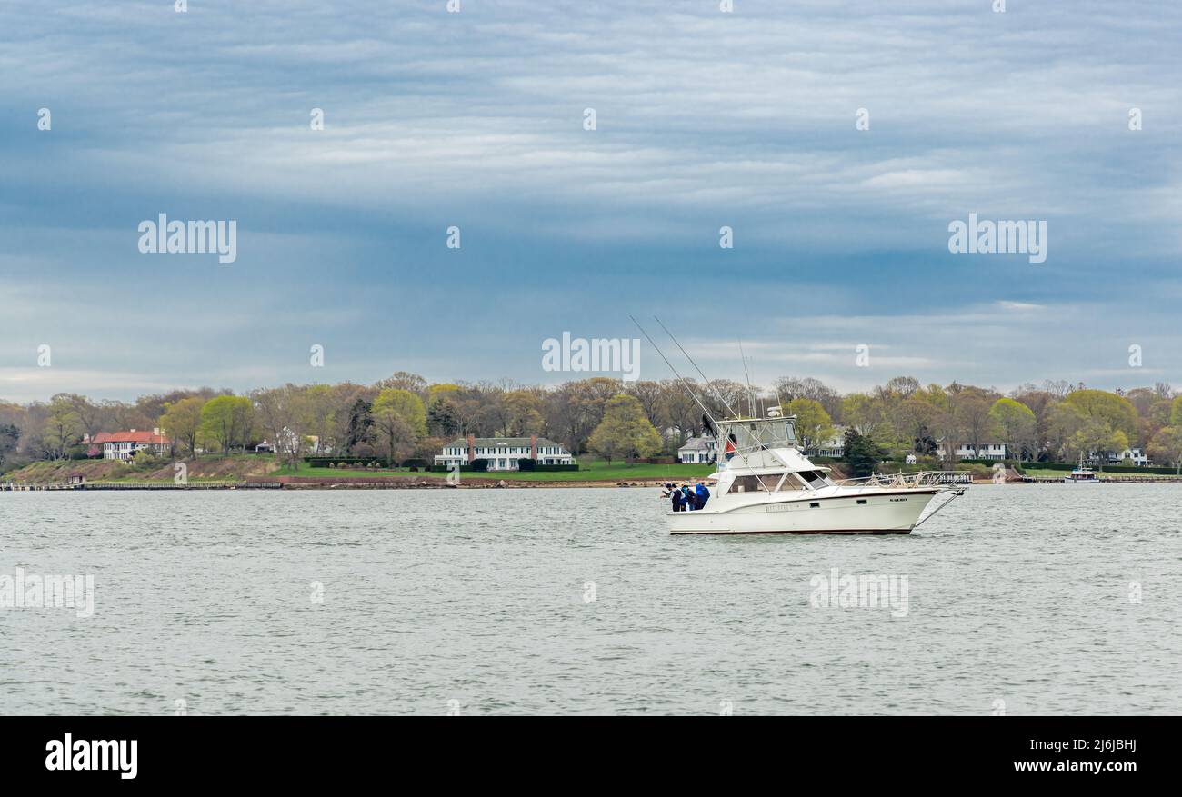 Sport Fishing boat, Black Rock with a group of men fishing in Dering Harbor, Shelter Island, NY Stock Photo