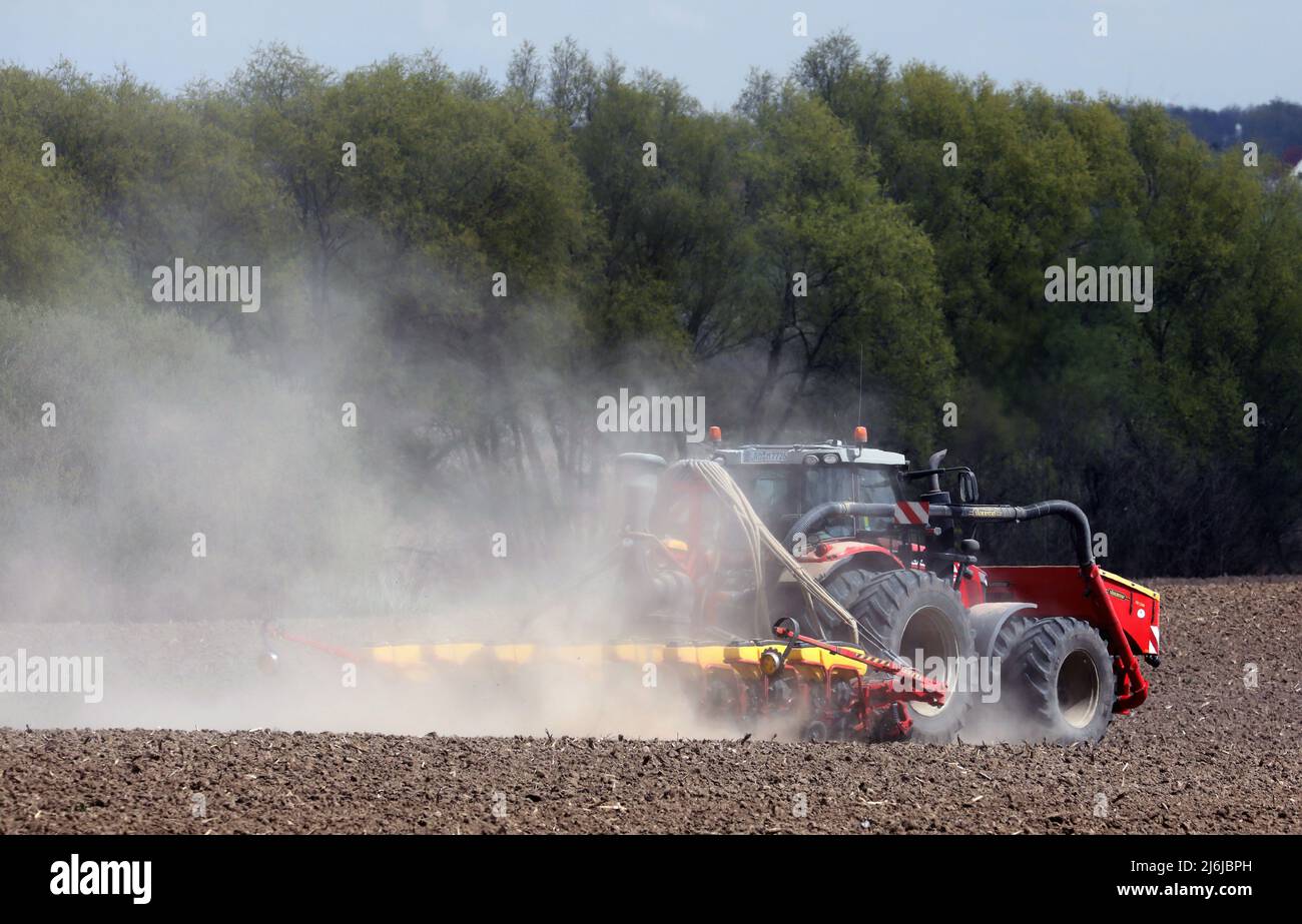 02 May 2022, MecklenburgWestern Pomerania, Clausdorf A tractor drags