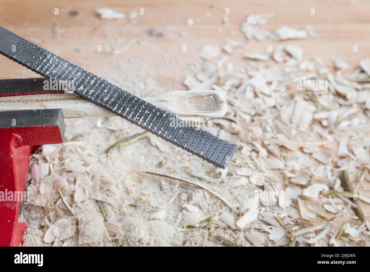 Self carved wooden spoon clamped in vice worked with wood rasp rasp on ...