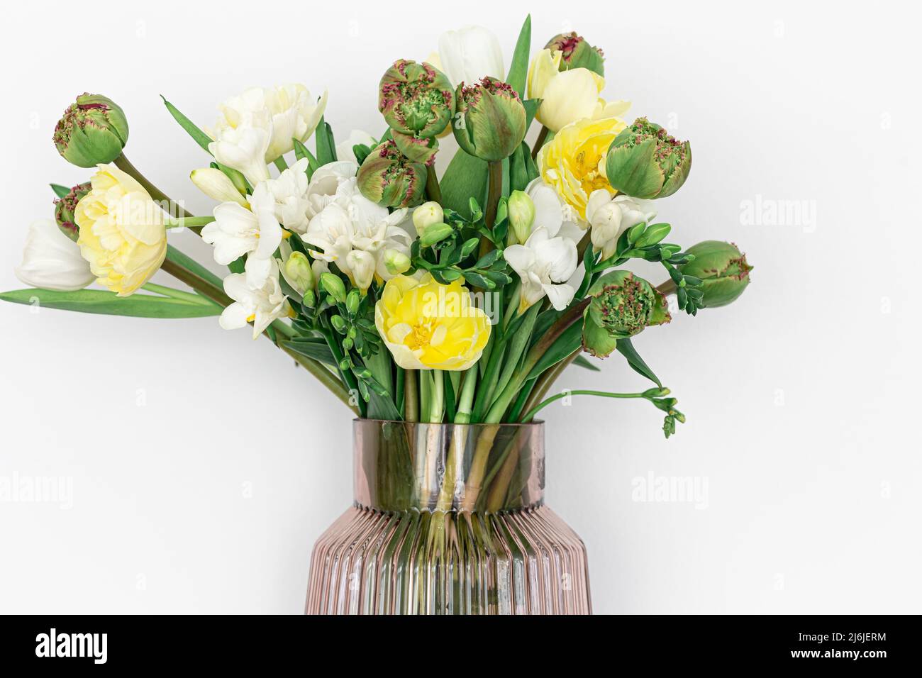 Glass vase with flowers isolated on white background Stock Photo - Alamy