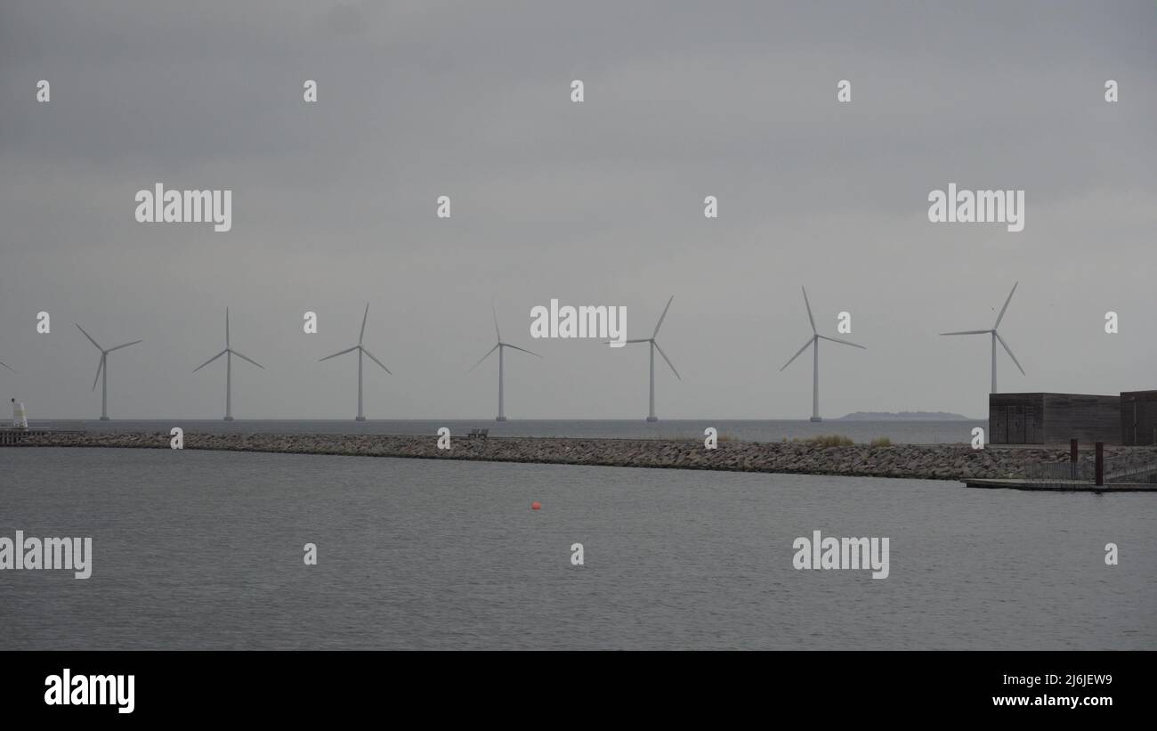 The theme is net power generation and environmental protection. A number of wind blades, wind power in the Baltic Sea in Europe Denmark Copenhagen in Stock Photo