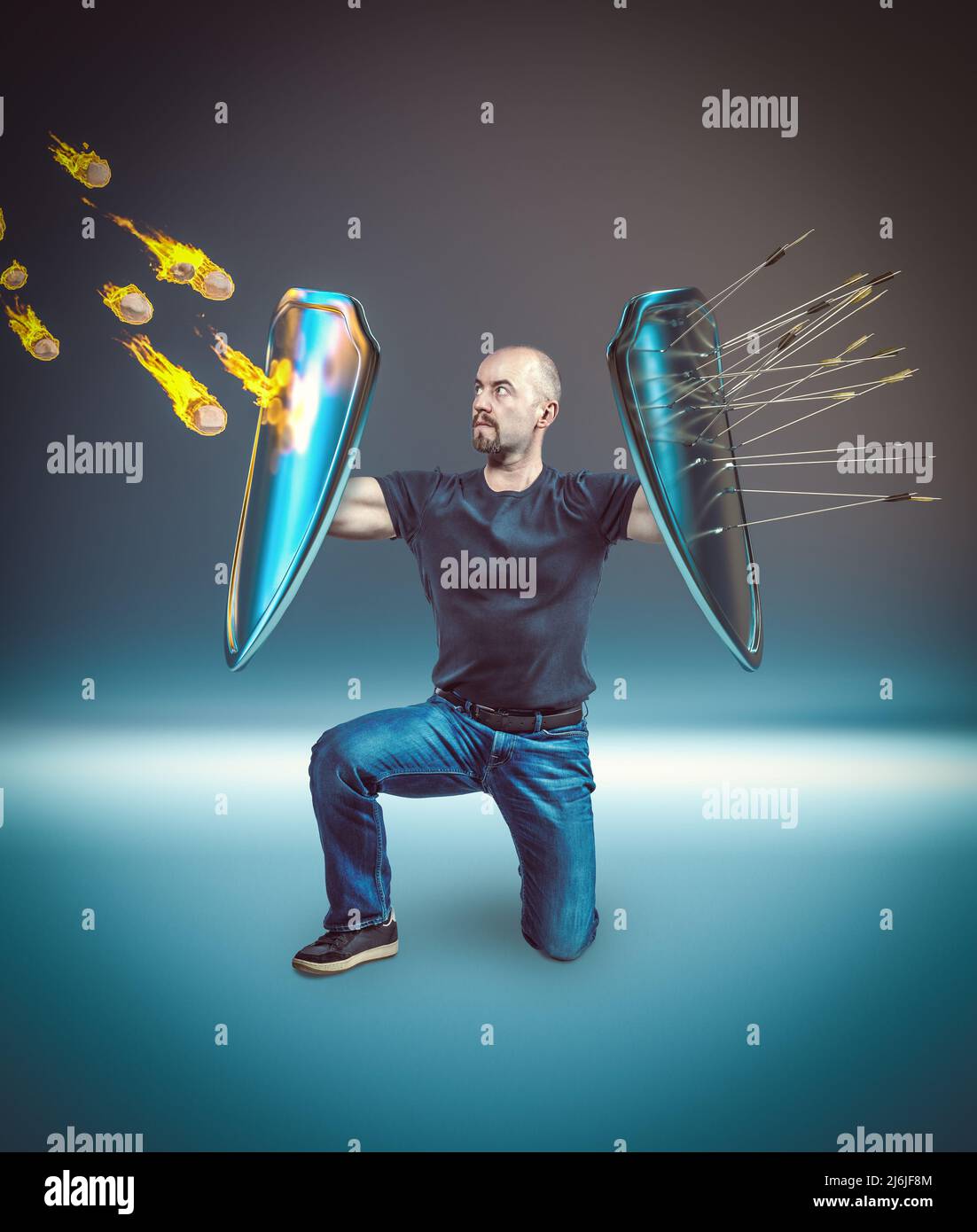 man with shields defends himself from simultaneous attacks Stock Photo