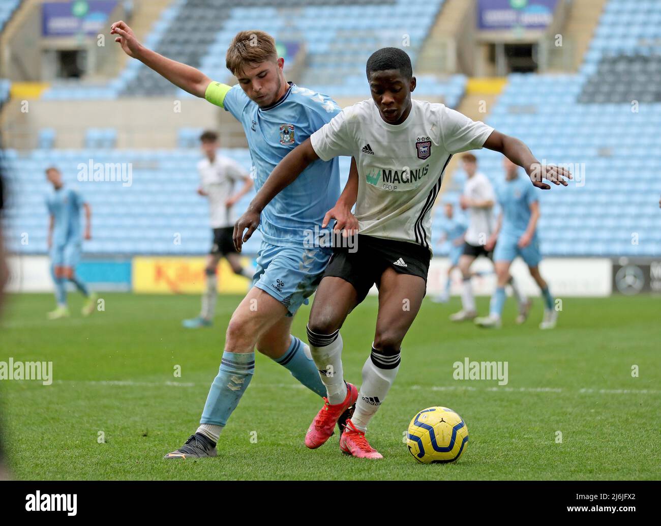 Coventry’s Callum Perry battles for the ball Ipswich’s Afi Adebayo during the Premier League Development Cup Final at the Coventry Building Society Arena, Coventry. Picture date: Monday May 2, 2022. Stock Photo