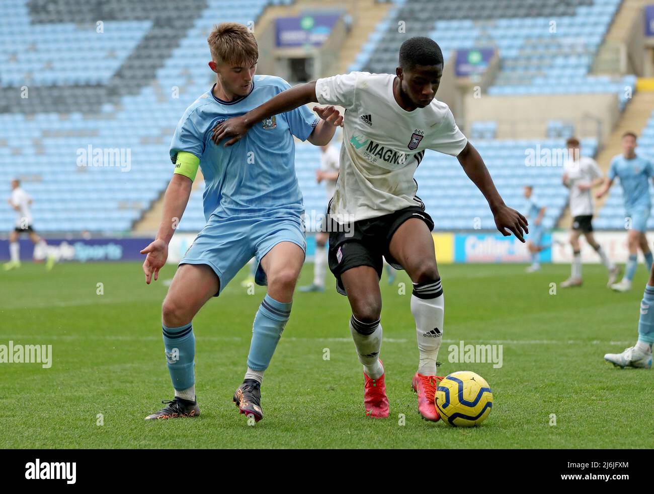 Coventry’s Callum Perry battles for the ball Ipswich’s Afi Adebayo during the Premier League Development Cup Final at the Coventry Building Society Arena, Coventry. Picture date: Monday May 2, 2022. Stock Photo