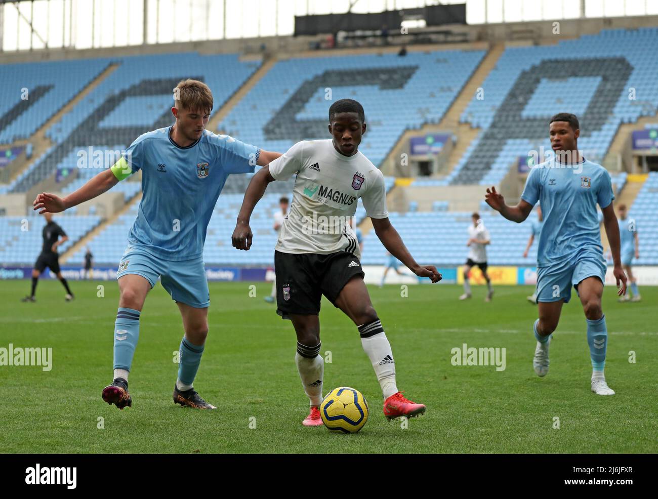 Coventry’s Callum Perry (left) battles for the ball Ipswich’s Afi Adebayo during the Premier League Development Cup Final at the Coventry Building Society Arena, Coventry. Picture date: Monday May 2, 2022. Stock Photo