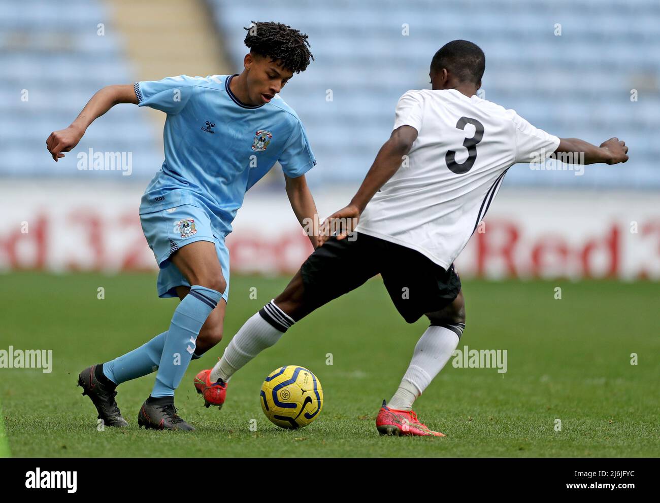 Coventry’s Che Ranger battles fir the ball with Ipswich’s Afi Adebayo during the Premier League Development Cup Final at the Coventry Building Society Arena, Coventry. Picture date: Monday May 2, 2022. Stock Photo