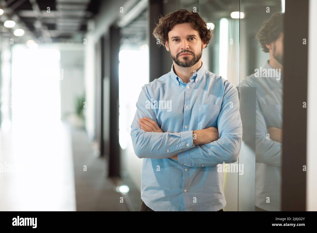Portrait of business man posing looking at camera Stock Photo - Alamy