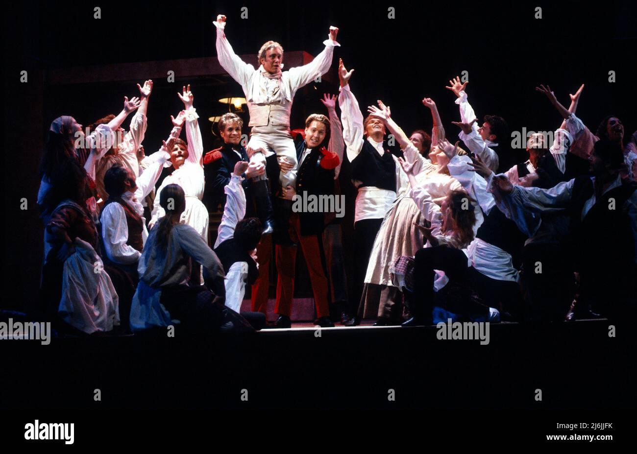 ensemble in BERNADETTE: The People’s Musical at the Dominion Theatre, London W1  21/06/1990  music: Gwyn Hughes  libretto: Maureen Hughes  set design: Martin Collins  costumes: Lynda Yong  lighting: Peter Zygadio  choreography: Pat Dennison  director: Ernest Maxin Stock Photo