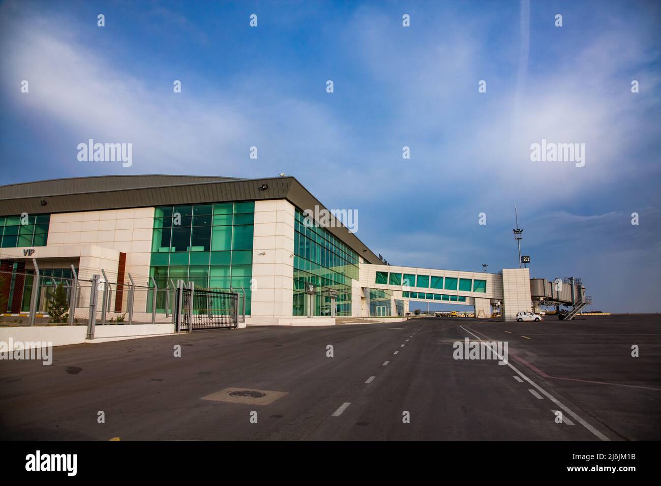 Aktau, Kazakhstan - May 21, 2012: International airport Aktau building (left), passengers gallery and gangway right. Stock Photo