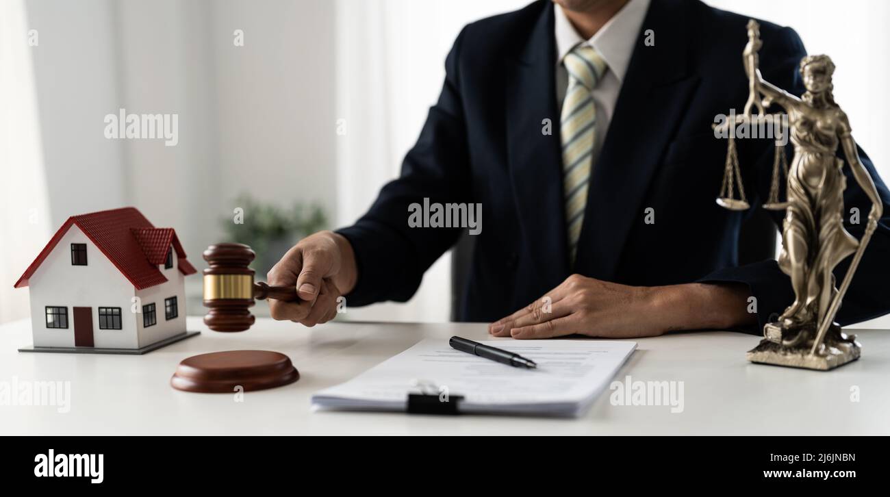 lawyers or notaries with gavel judge for the insurance compensations. concept of law and lawyer, judiciary and legislature applied to the democratic Stock Photo