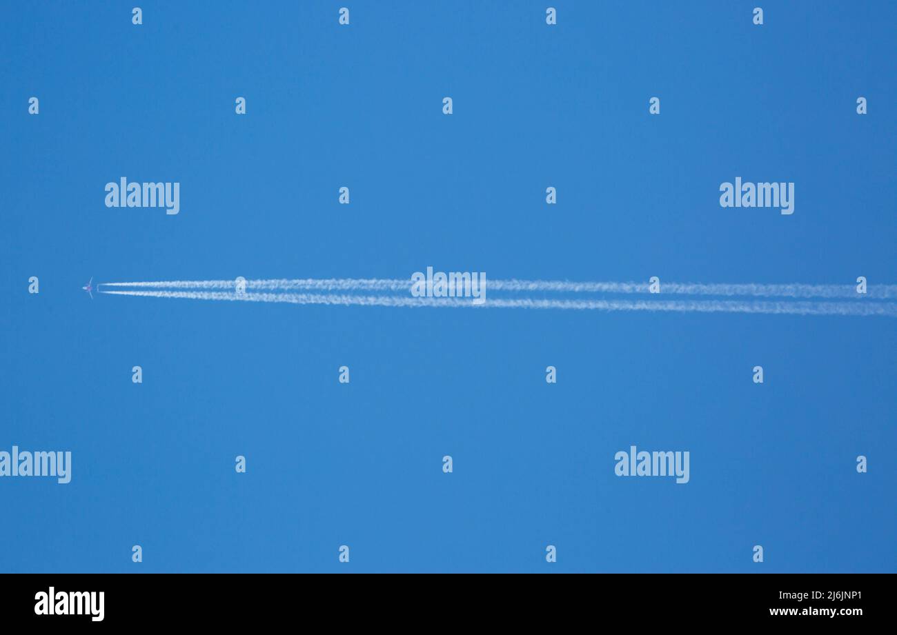 An Aircraft High in a Blue Sky Stock Photo - Alamy