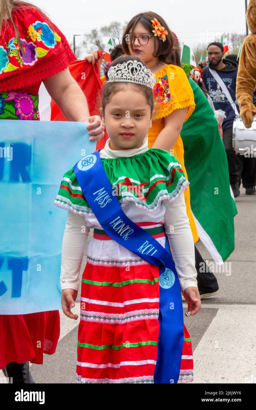 Detroit, Michigan USA - 1 May 2022 - Miss Honor Roll from Voyageur Academy, a charter school, marches in the Cinco de Mayo parade in Detroit's Mexican-American neighborhood. The annual parade returned in 2022 after a two-year hiatus due to the pandemic. Cinco de Mayo celebrates a Mexican victory over the French on May 5, 1862. Credit: Jim West/Alamy Live News Stock Photo