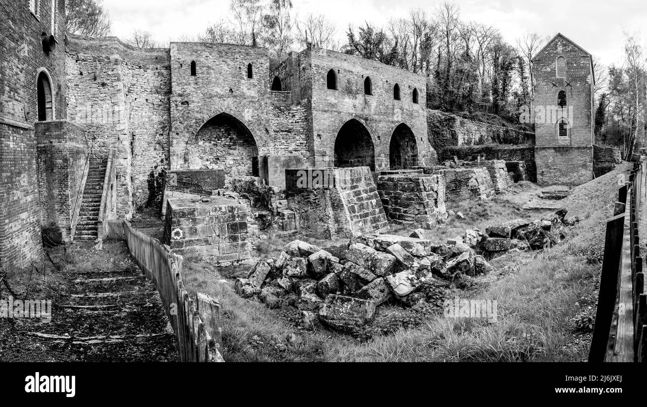 The image here is of what remains of the abandoned iron-smelting blast furnaces at Blist Hill Victorian Town as it was in 1900 Stock Photo