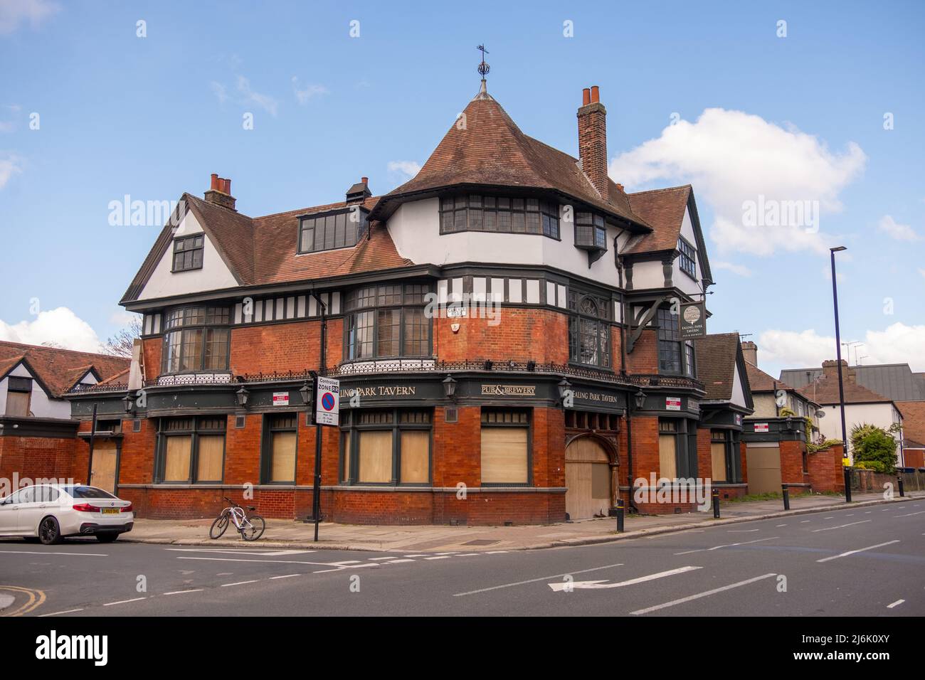 London- April 2022: A vacant pub with boarded up windows in Ealing, West London Stock Photo