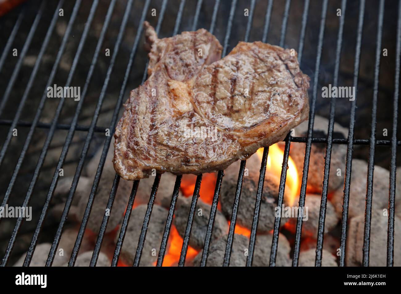 welldone steak on grill Stock Photo Alamy