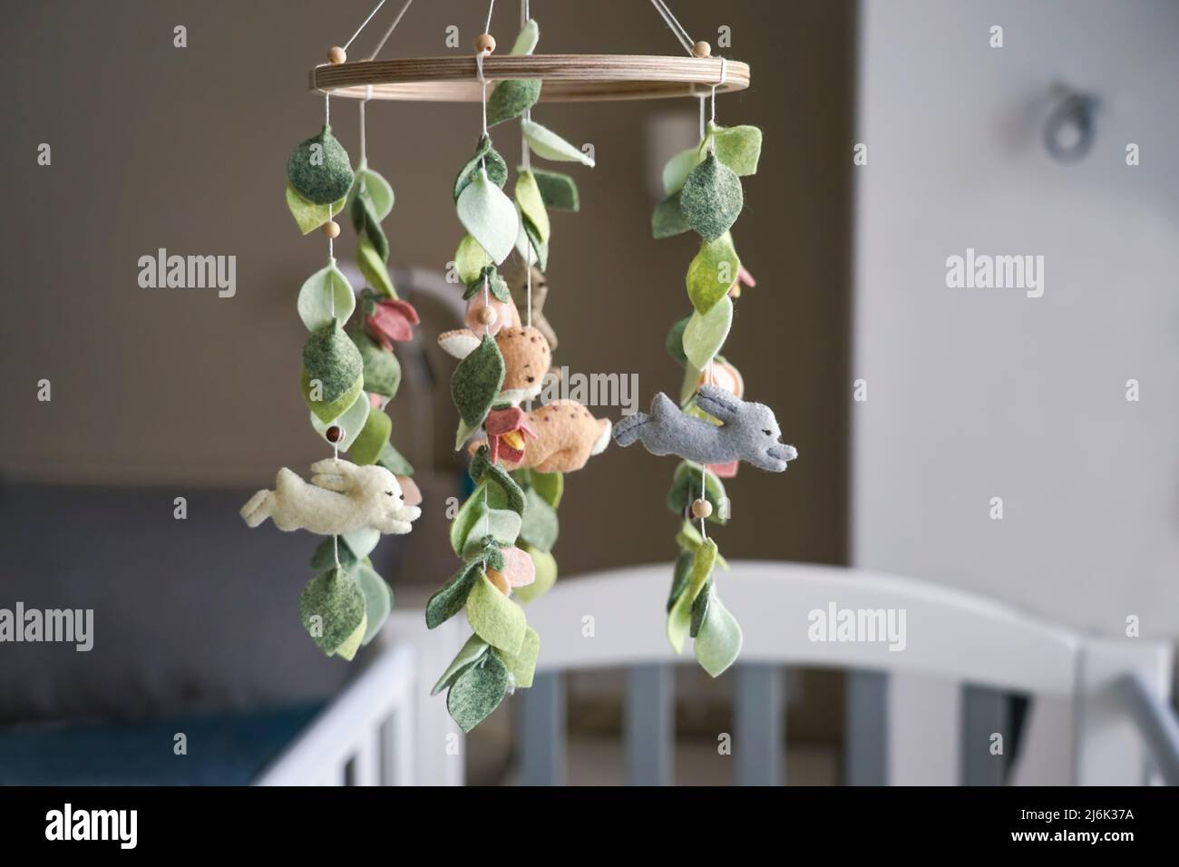 Diy craft baby crib mobile. Toys hang over the crib Stock Photo Alamy