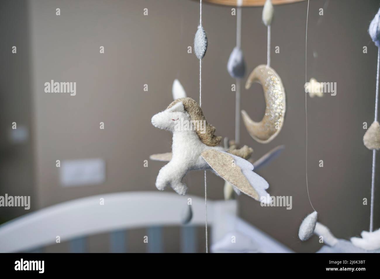 Diy craft baby crib mobile. Toys hang over the crib Stock Photo Alamy