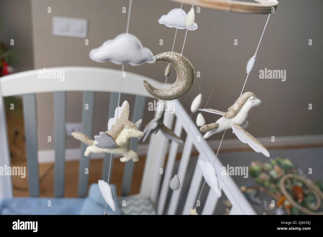 Diy craft baby crib mobile. Toys hang over the crib Stock Photo Alamy
