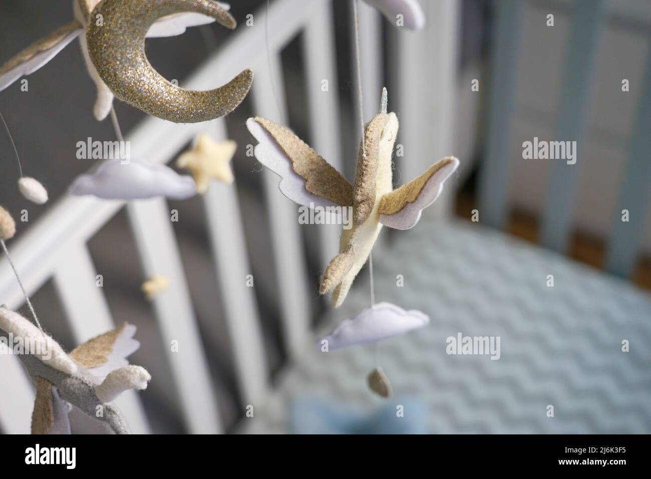 Diy craft baby crib mobile. Toys hang over the crib Stock Photo Alamy