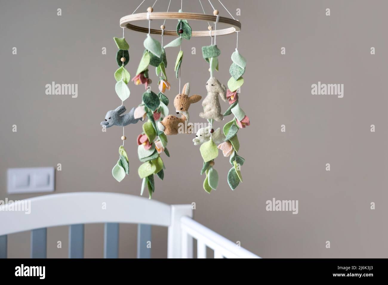 Diy craft baby crib mobile. Toys hang over the crib Stock Photo Alamy
