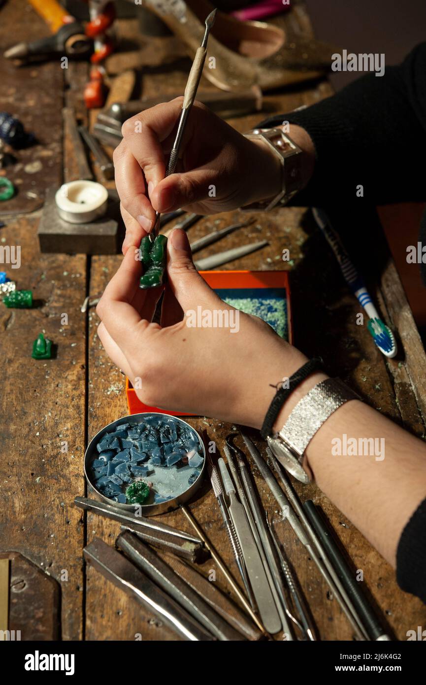 Goldsmith at work in his workshop. Stock Photo