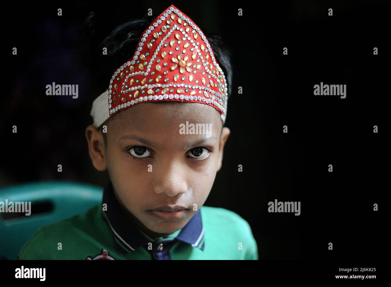 Dhaka, Bangladesh. 2nd May 2022. Portrait of a child ready for Eid al-Fitr. Also known as the Geneva camp, it has about 50 thousand Urdu speaking Indian & Pakistani people living at the camp. The Bihari minority remain some of Bangladesh’s most marginalized communities. Credit: Majority World CIC/Alamy Live News Stock Photo