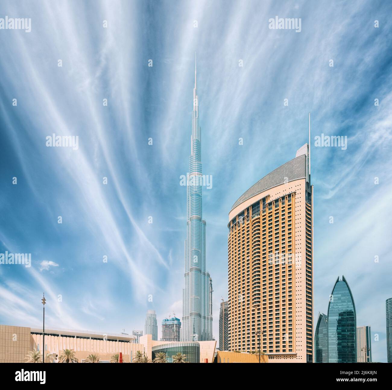 View of hotel Address Dubai Marina, Dubai mall and Burj Khalifa against blue and white sky. View of landmarks of residential district in Dubai Marina Stock Photo
