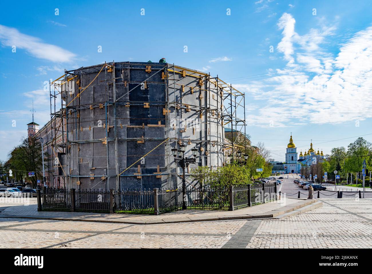The monument to Bohdan Khmelnytsky is closed with a protective structure with Mykhailivsky cathedral on background Stock Photo