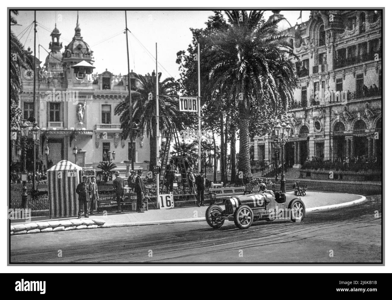 The 1930 Monaco Grand Prix with Louis Chiron (second place) in a works Bugatti.  A Grand Prix motor race held at the Circuit de Monaco on 6 April 1930. Frenchman René Dreyfus won the race in a privateer Bugatti, ahead of the works Bugatti 35 C of Louis Chiron seen here Number 18 who came in second, pictured with the Casino de Monaco behind. Monaco Monte Carlo Riviera Stock Photo